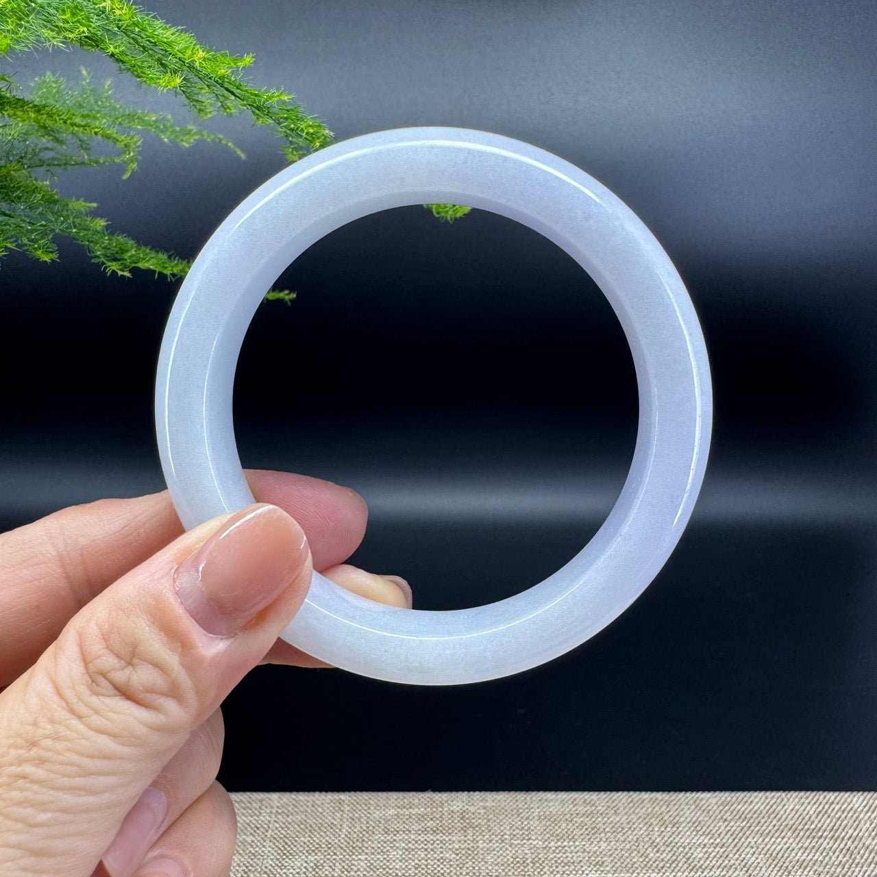 The bangle shape of the half round.The bangle color is lavender.