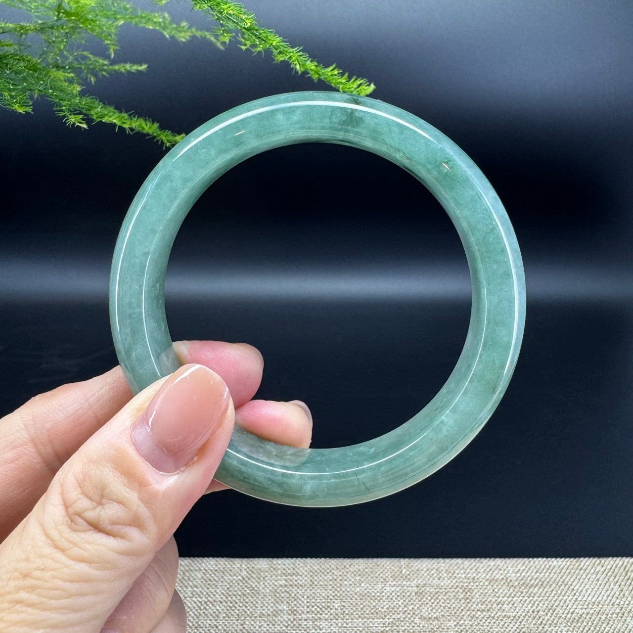 The bangle shape of the half round.The bangle color is oil green.