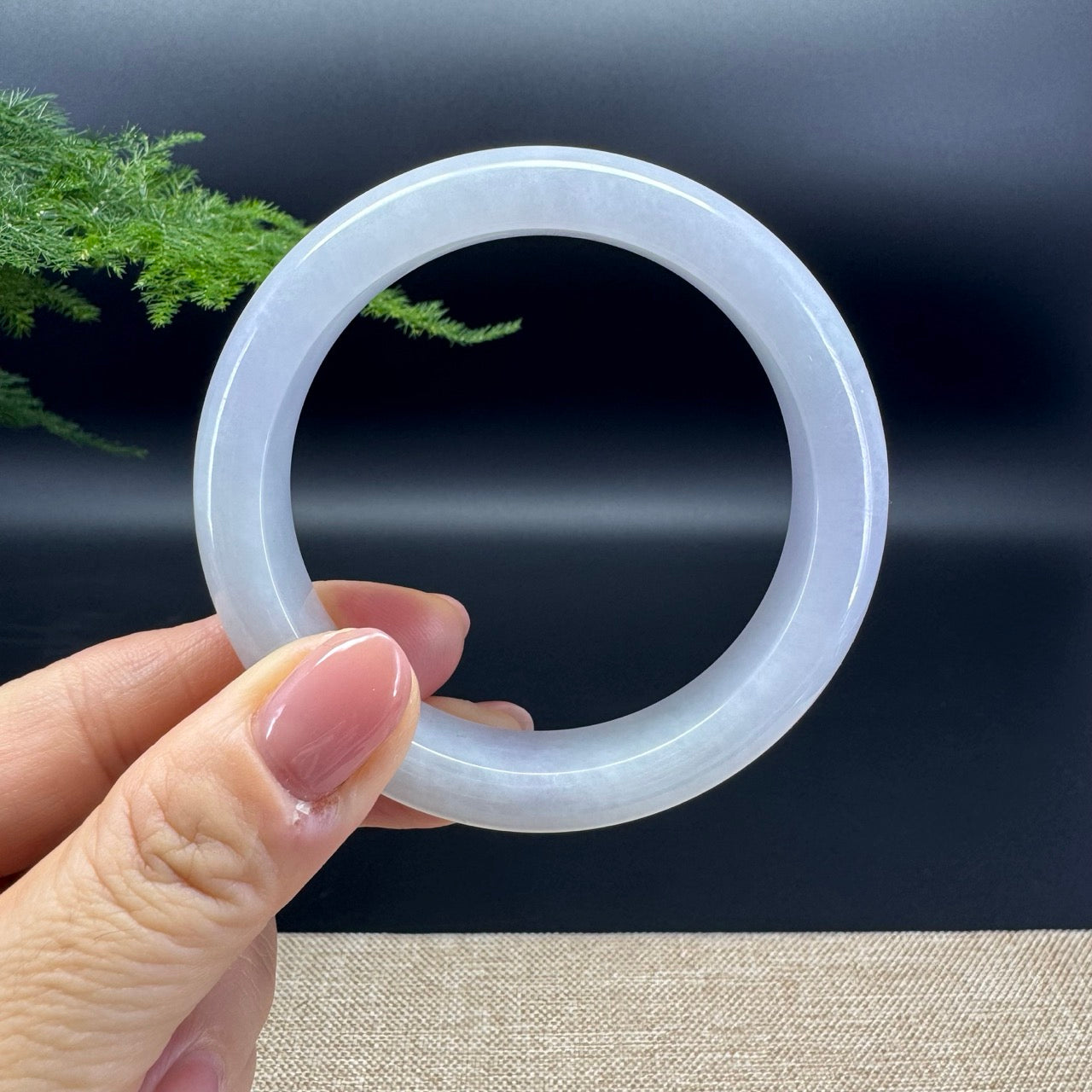 The bangle shape of the half round.The bangle color is lavender.