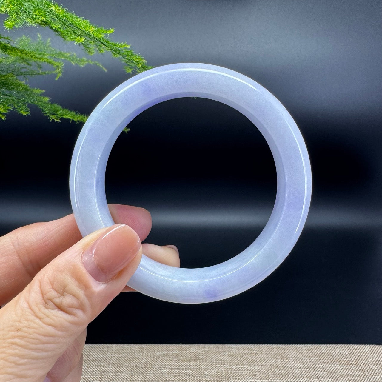 The bangle shape of the half round.The bangle color is lavender.