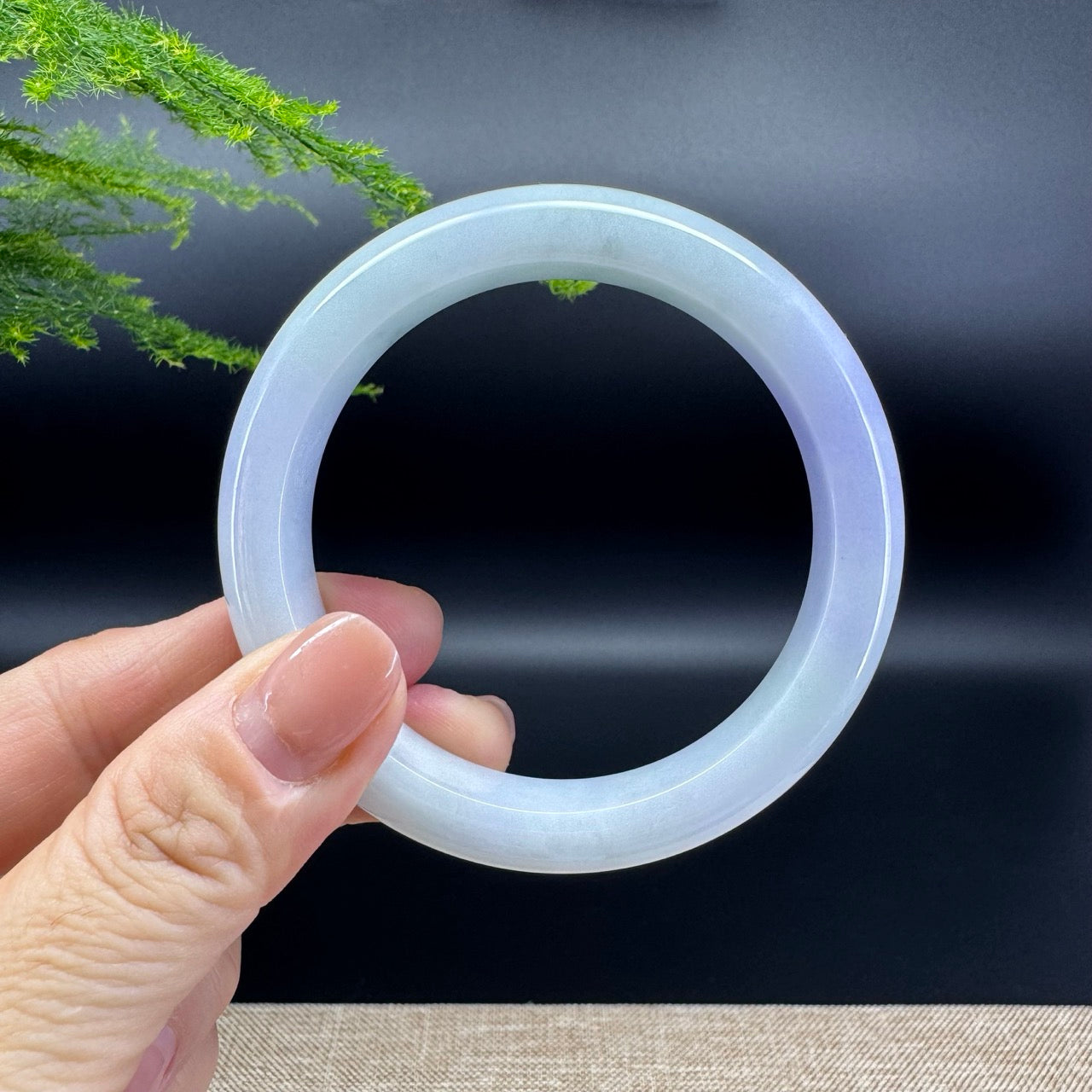 The bangle shape of the half round.The bangle color is lavender green.