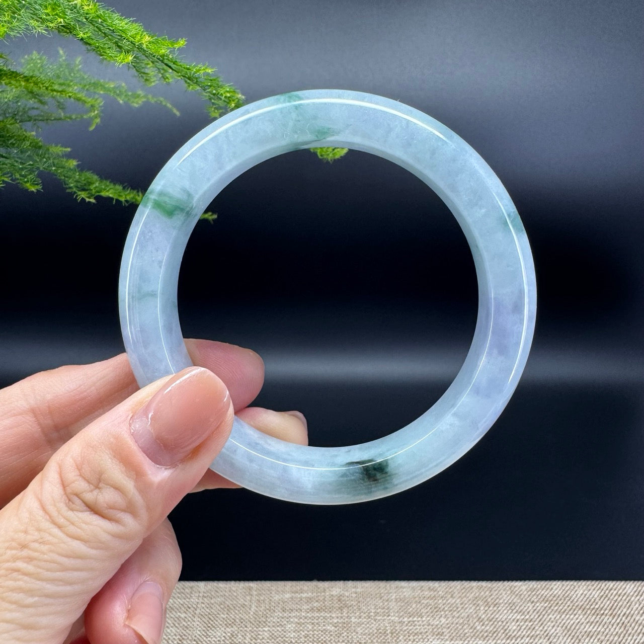 The bangle shape of the half round.The bangle color is icy oil green.