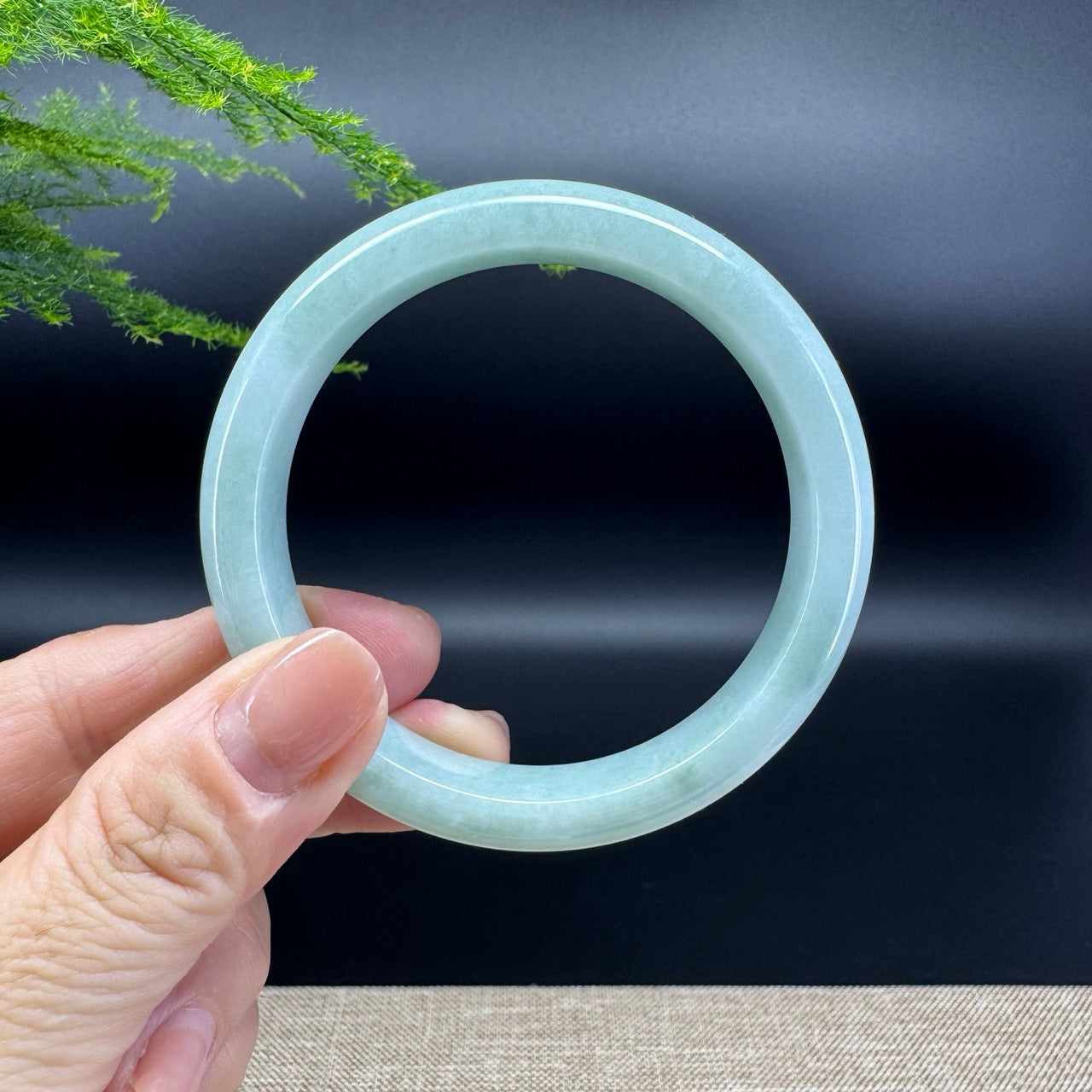 The bangle shape of the half round.The bangle color is green.