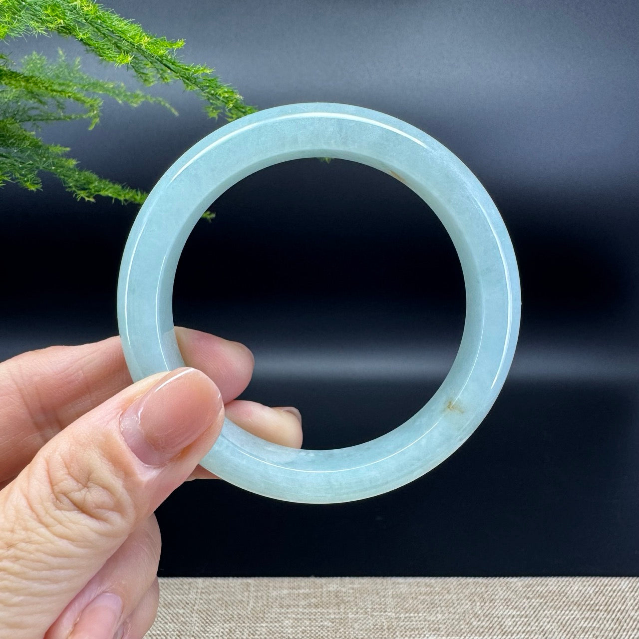 The bangle shape of the half round.The bangle color is icy green.