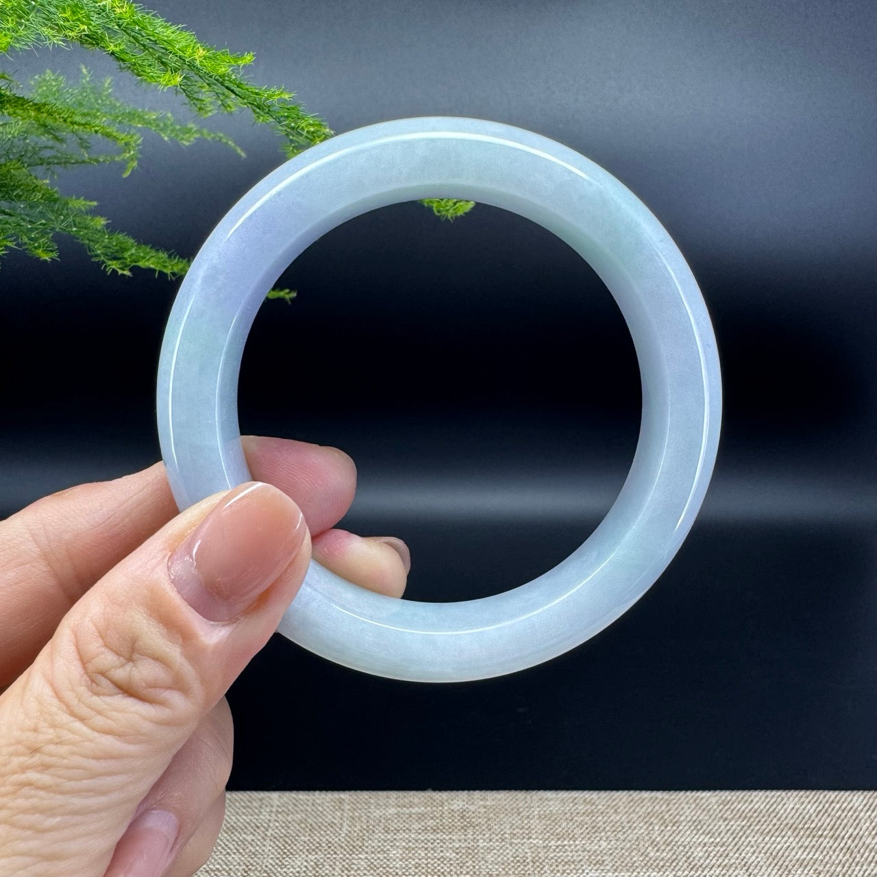 The bangle shape of the half round.The bangle color is lavender green.
