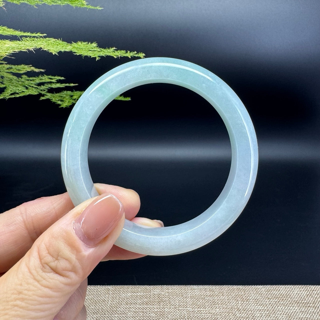 The bangle shape of the half round.The bangle color is green.