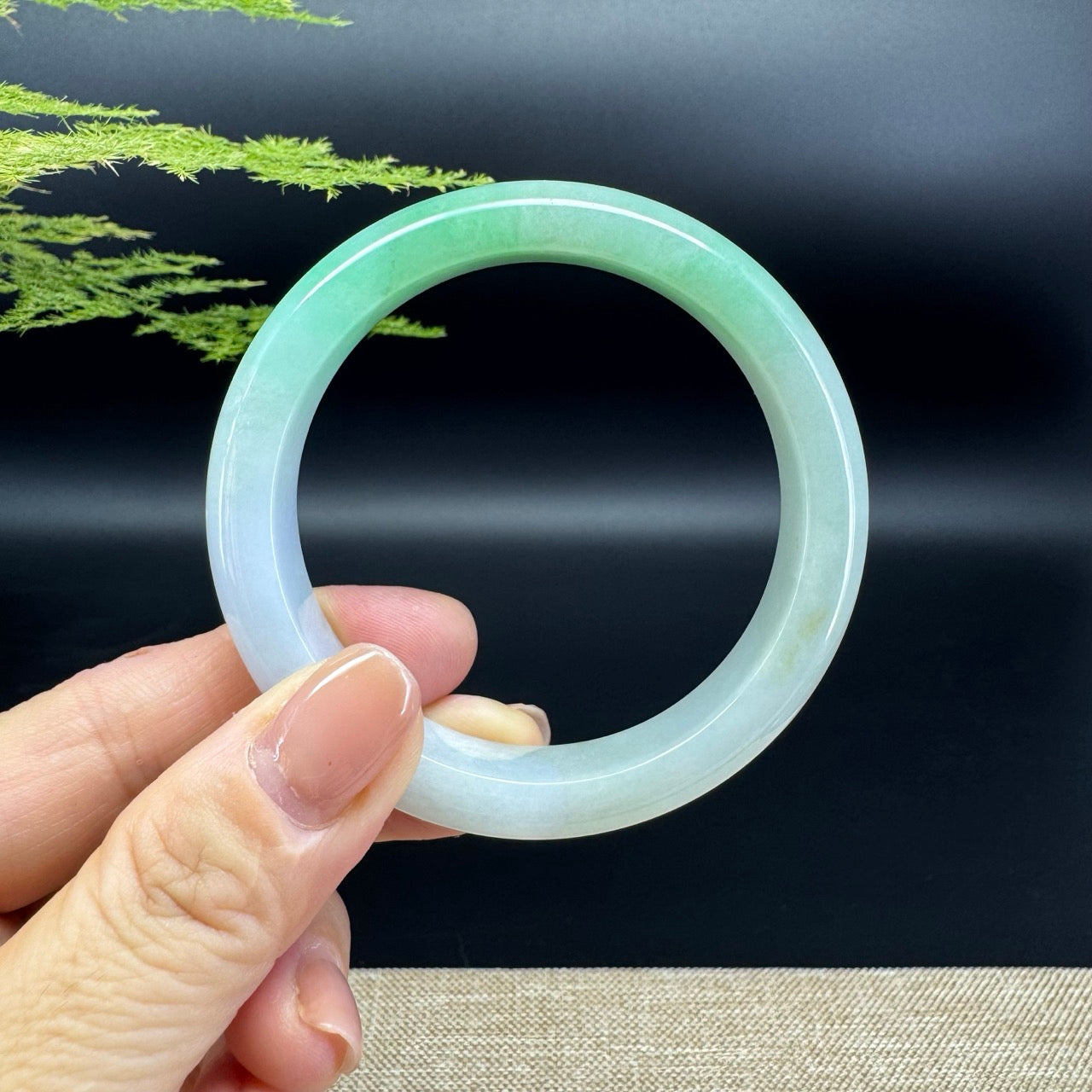 The bangle shape of the half round.The bangle color is icy lavender green.