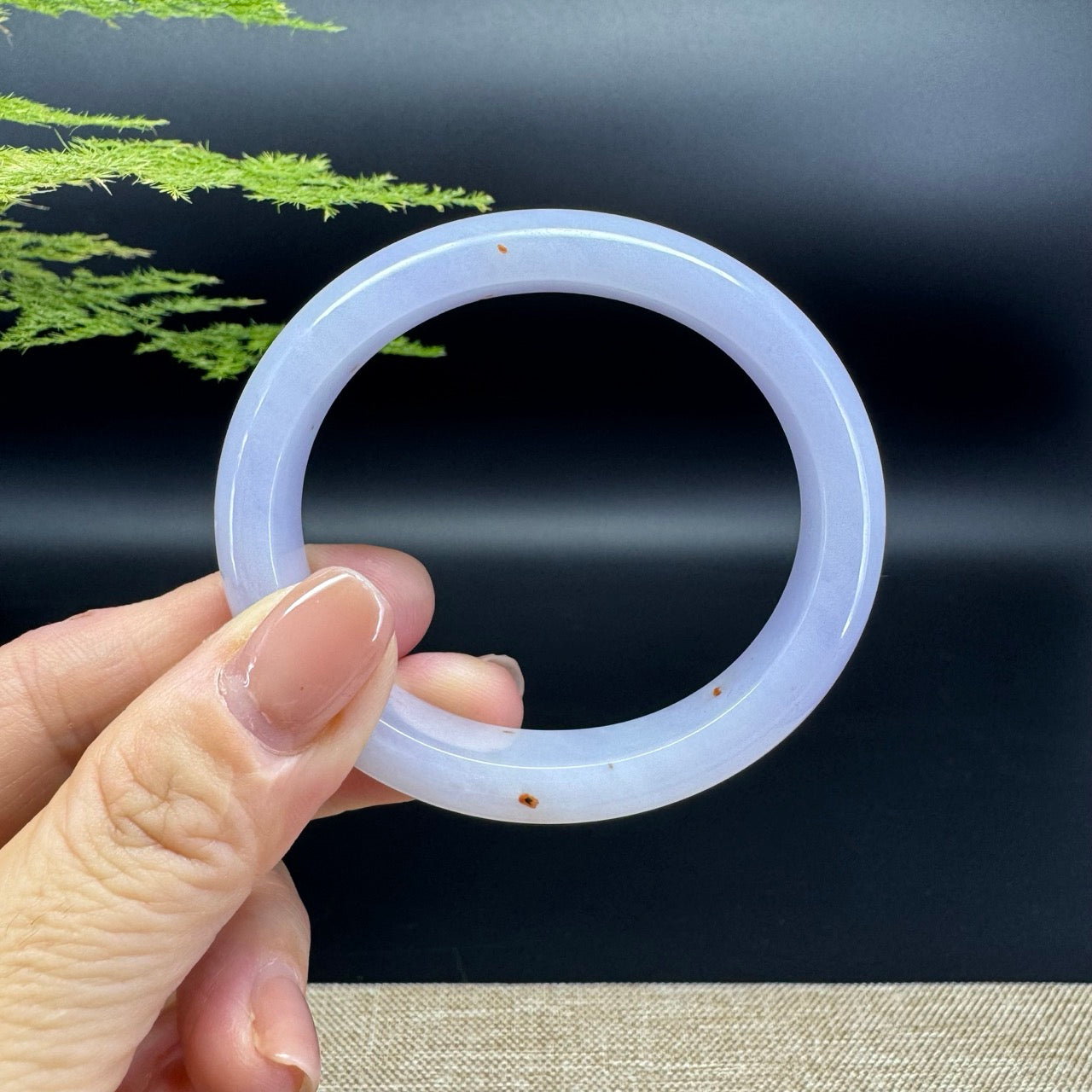 The bangle shape of the oval half round.The bangle color is lavender.