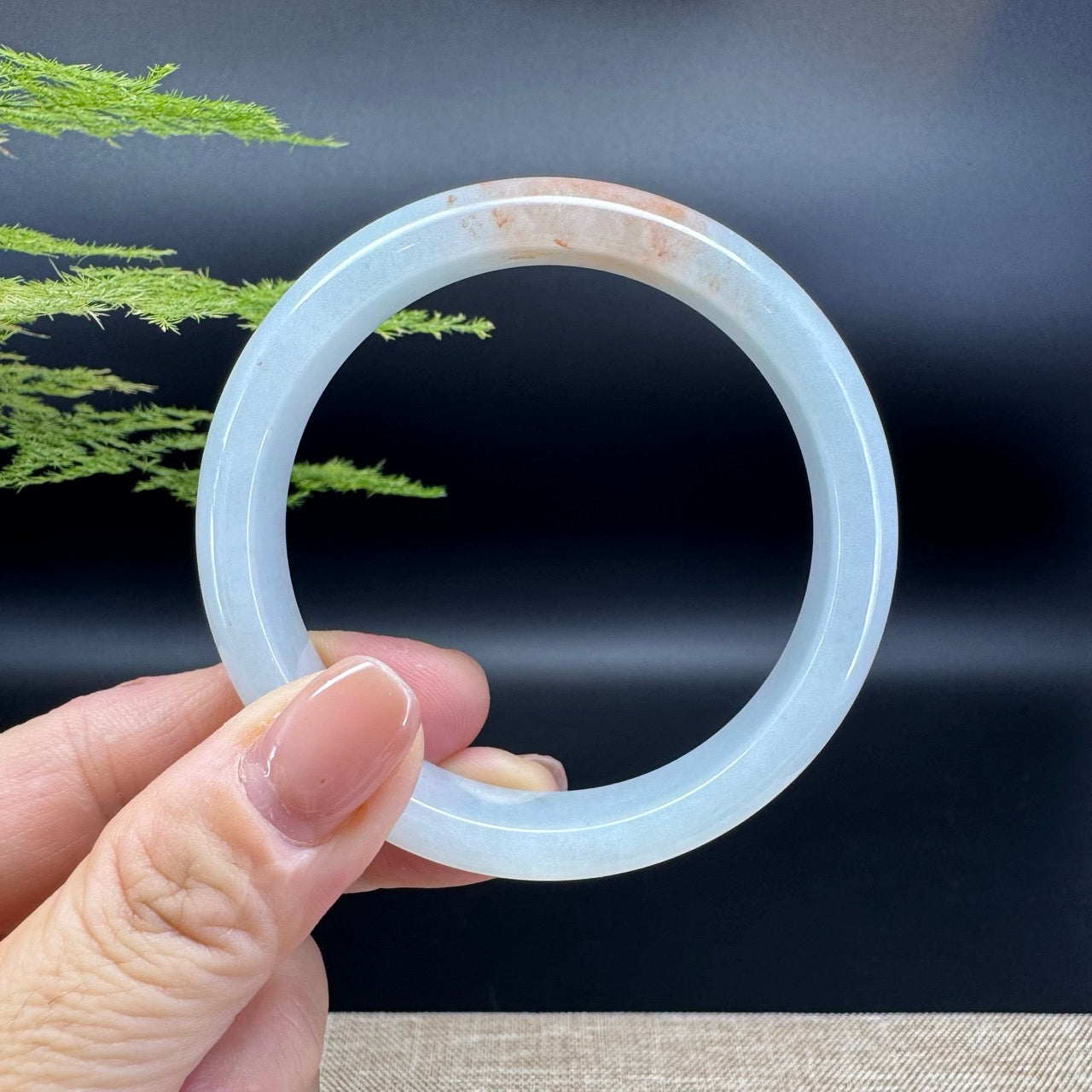 The bangle shape of the half round.The bangle color is white orange.