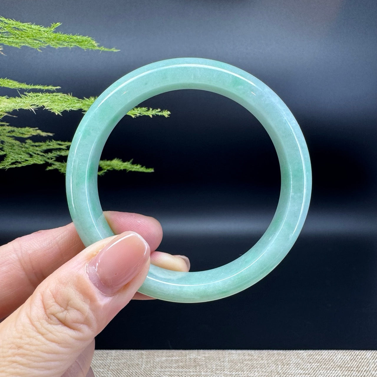 The bangle shape of the half round.The bangle color is apple green.