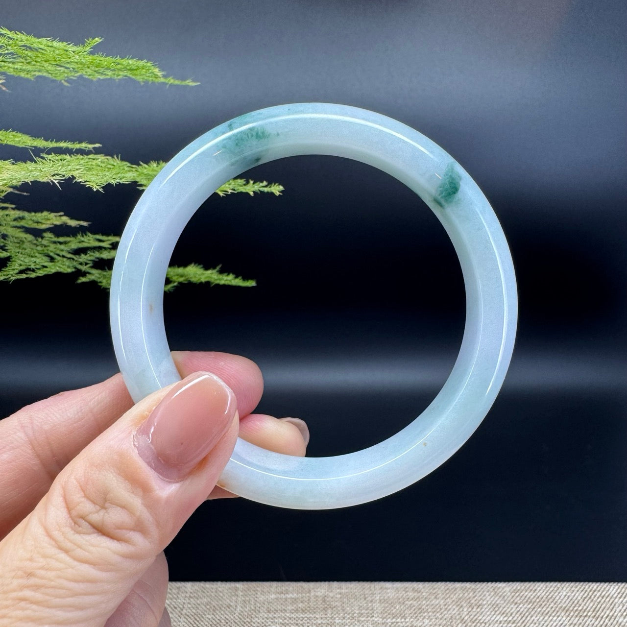 The bangle shape of the half round.The bangle color is icy lavender green.