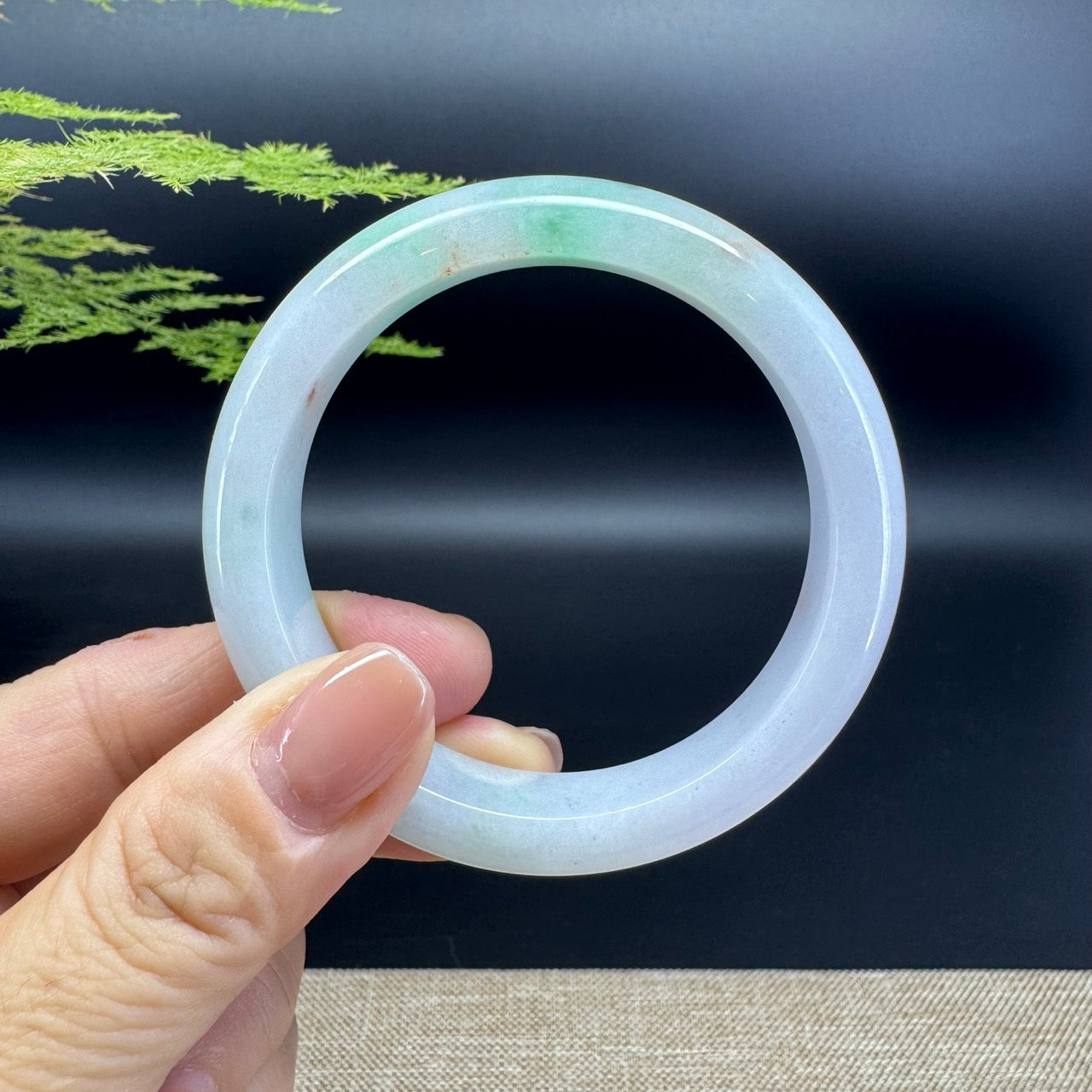 The bangle shape of the half round.The bangle color is icy green.