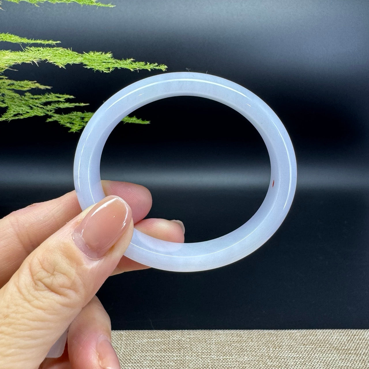 The bangle shape of the half round.The bangle color is lavender.