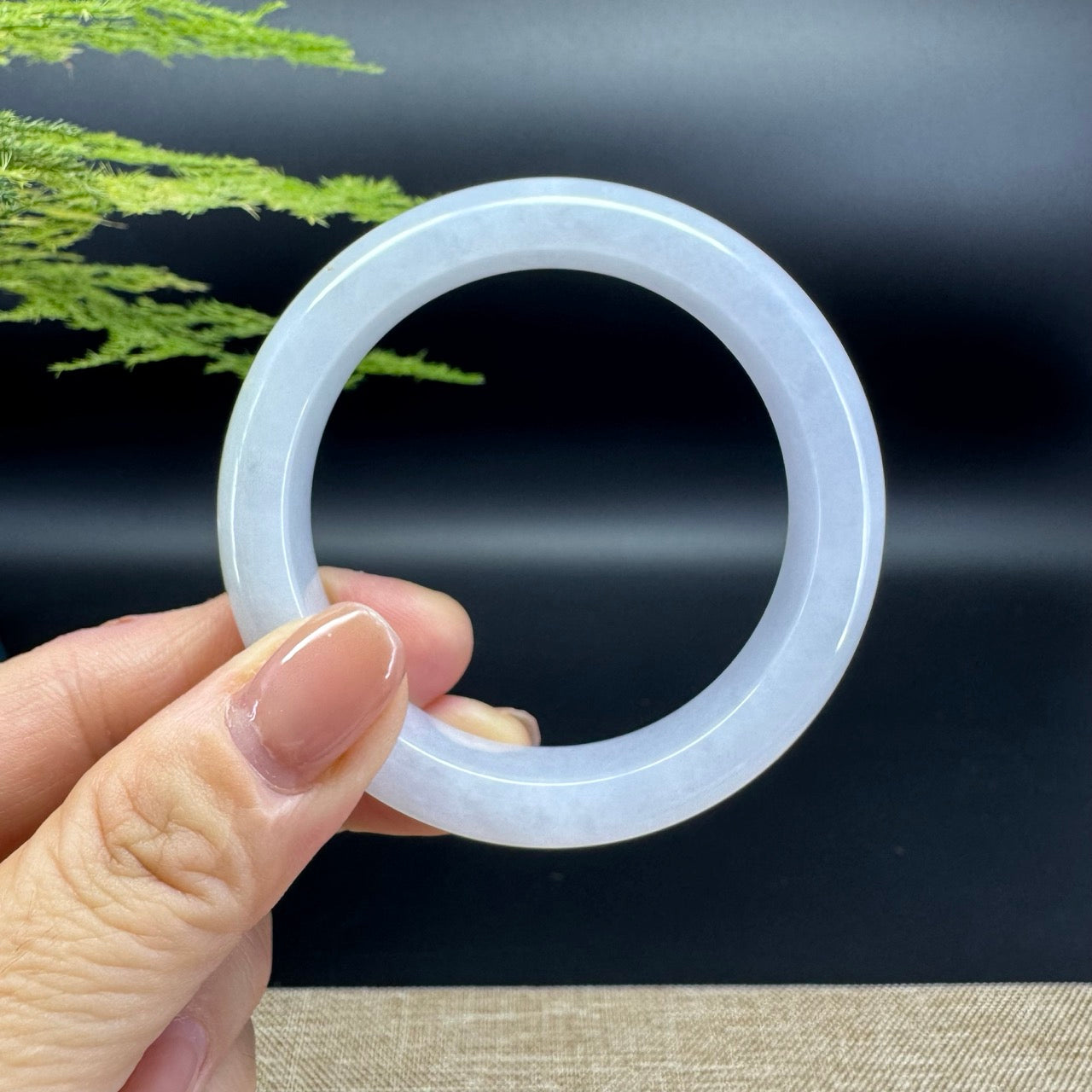 The bangle shape of the half round.The bangle color is lavender.