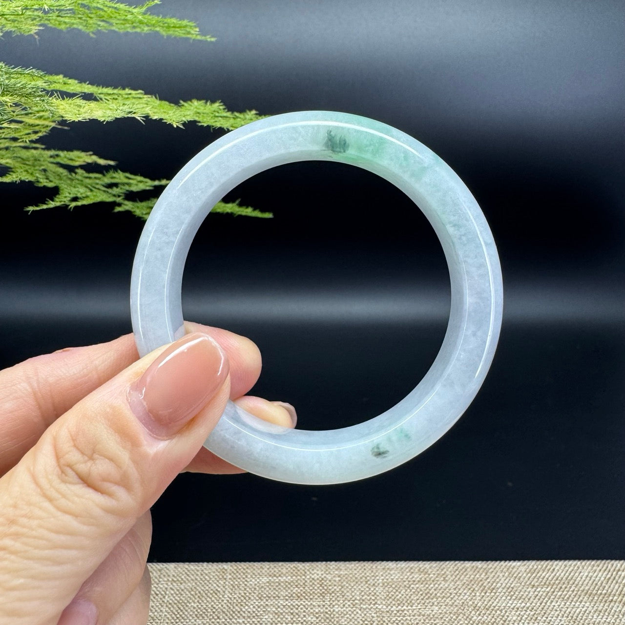 The bangle shape of the half round.The bangle color is icy green.