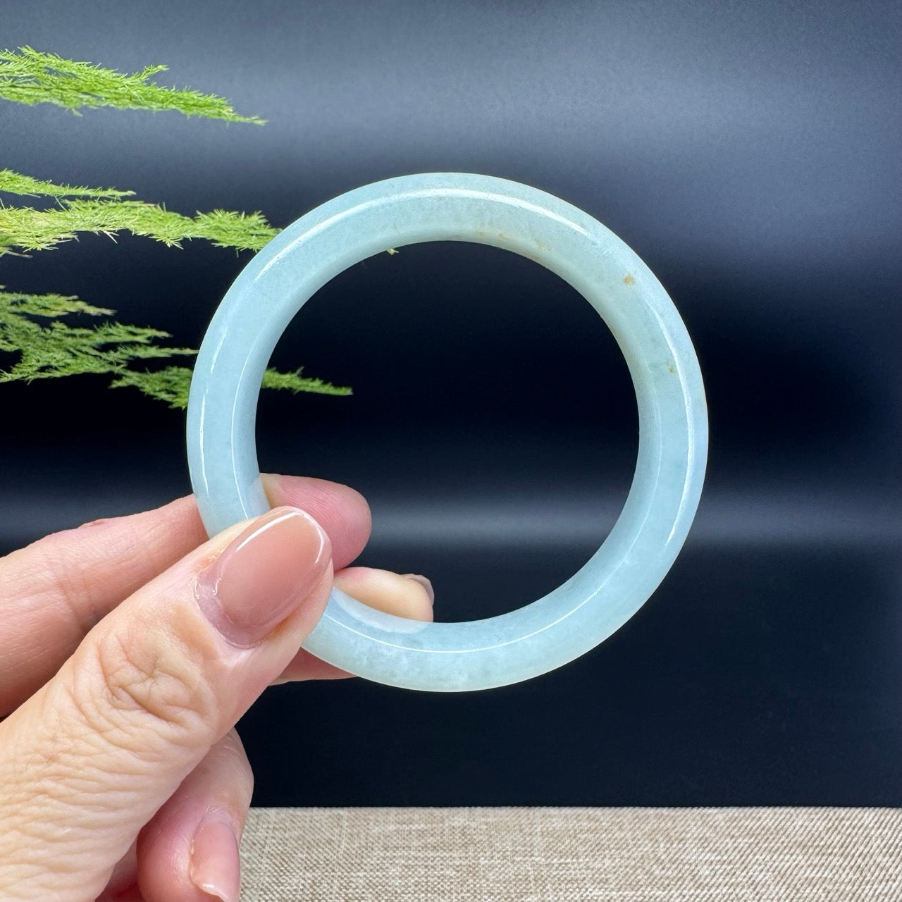 The bangle shape of the half round.The bangle color is icy green.