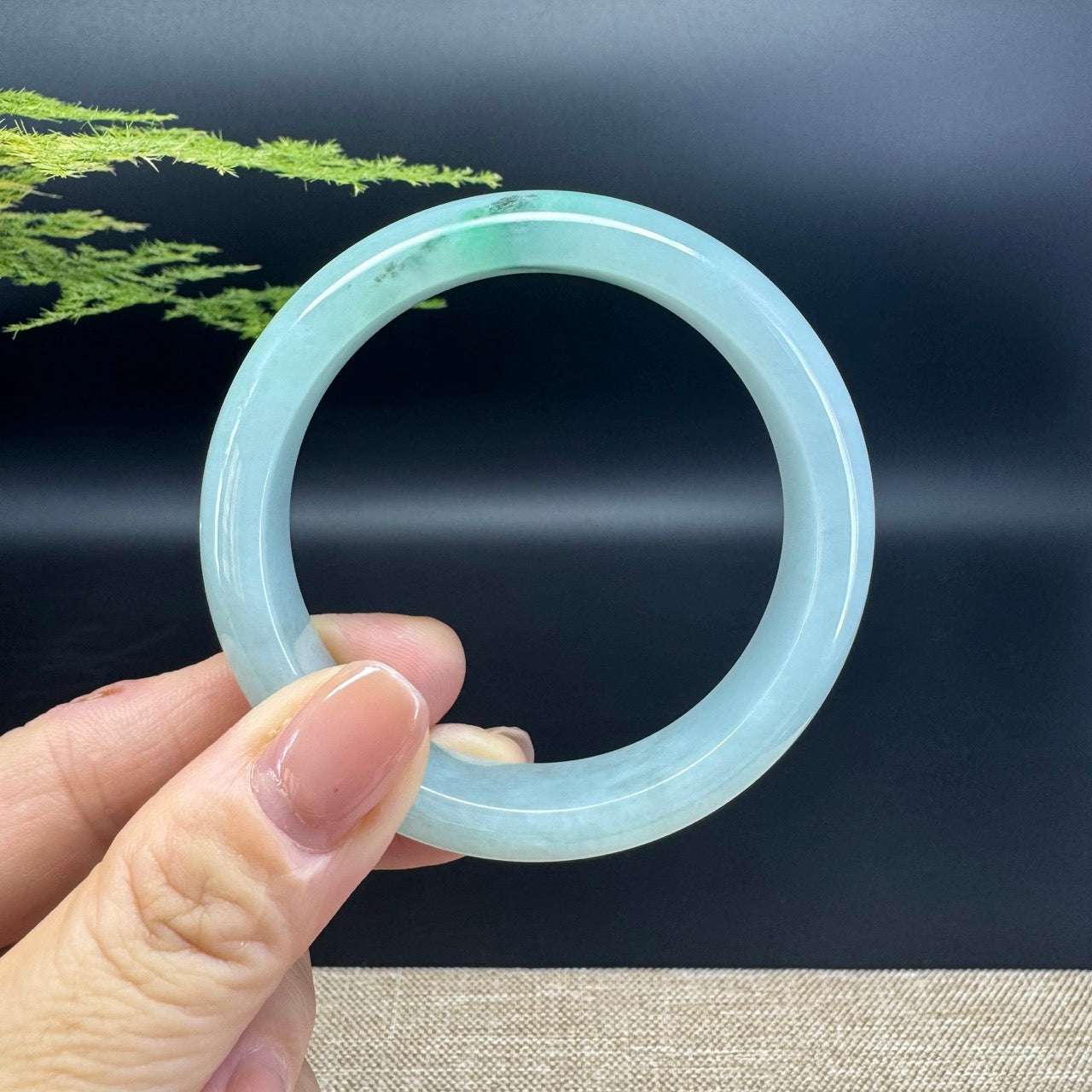 The bangle shape of the half round.The bangle color is icy green.