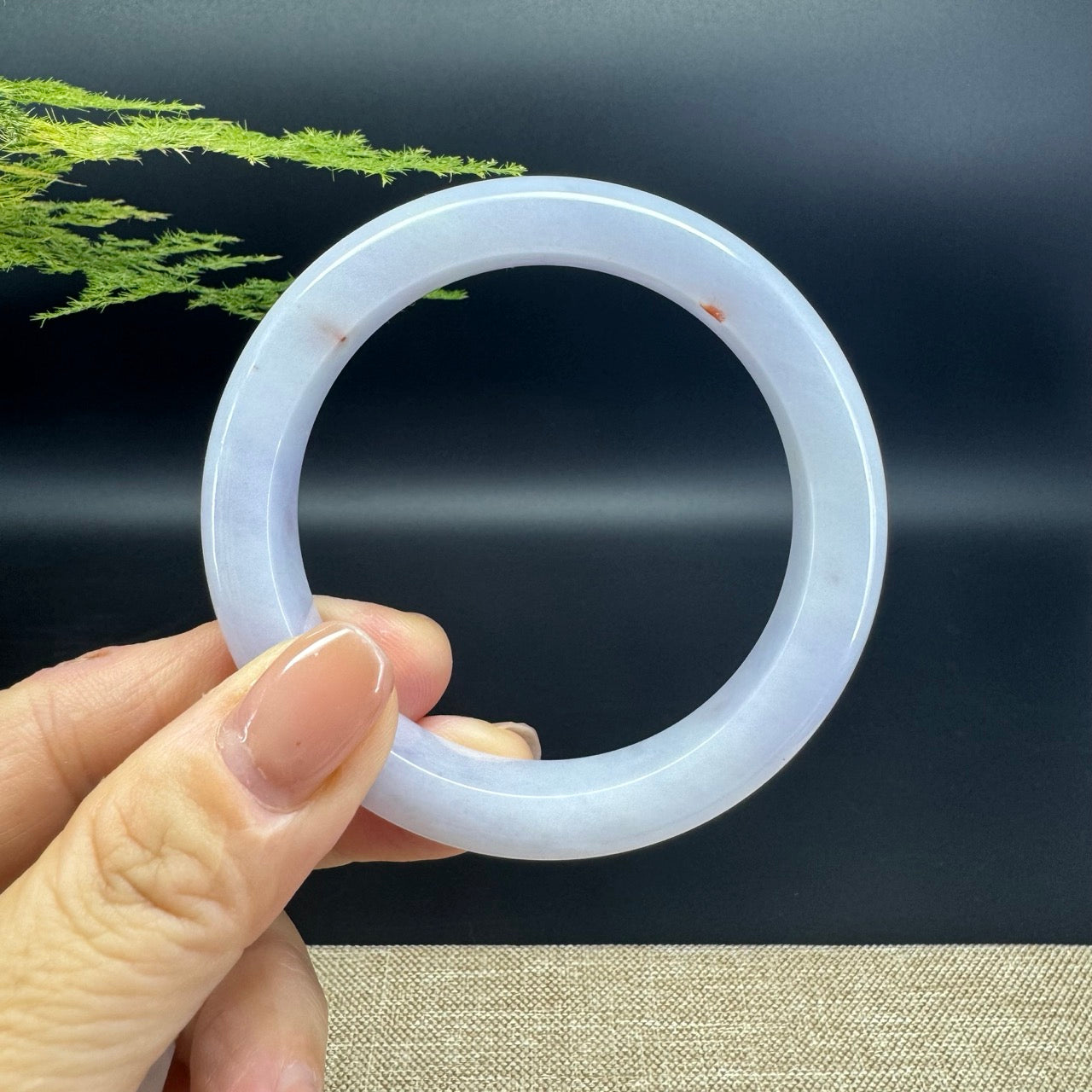 The bangle shape of the half round.The bangle color is lavender.
