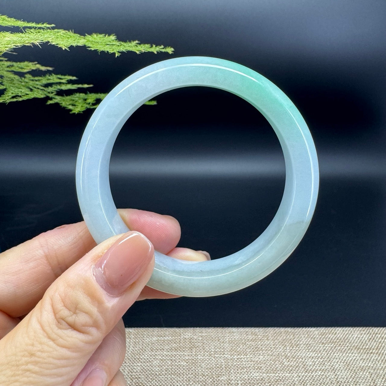 The bangle shape of the half round.The bangle color is green.