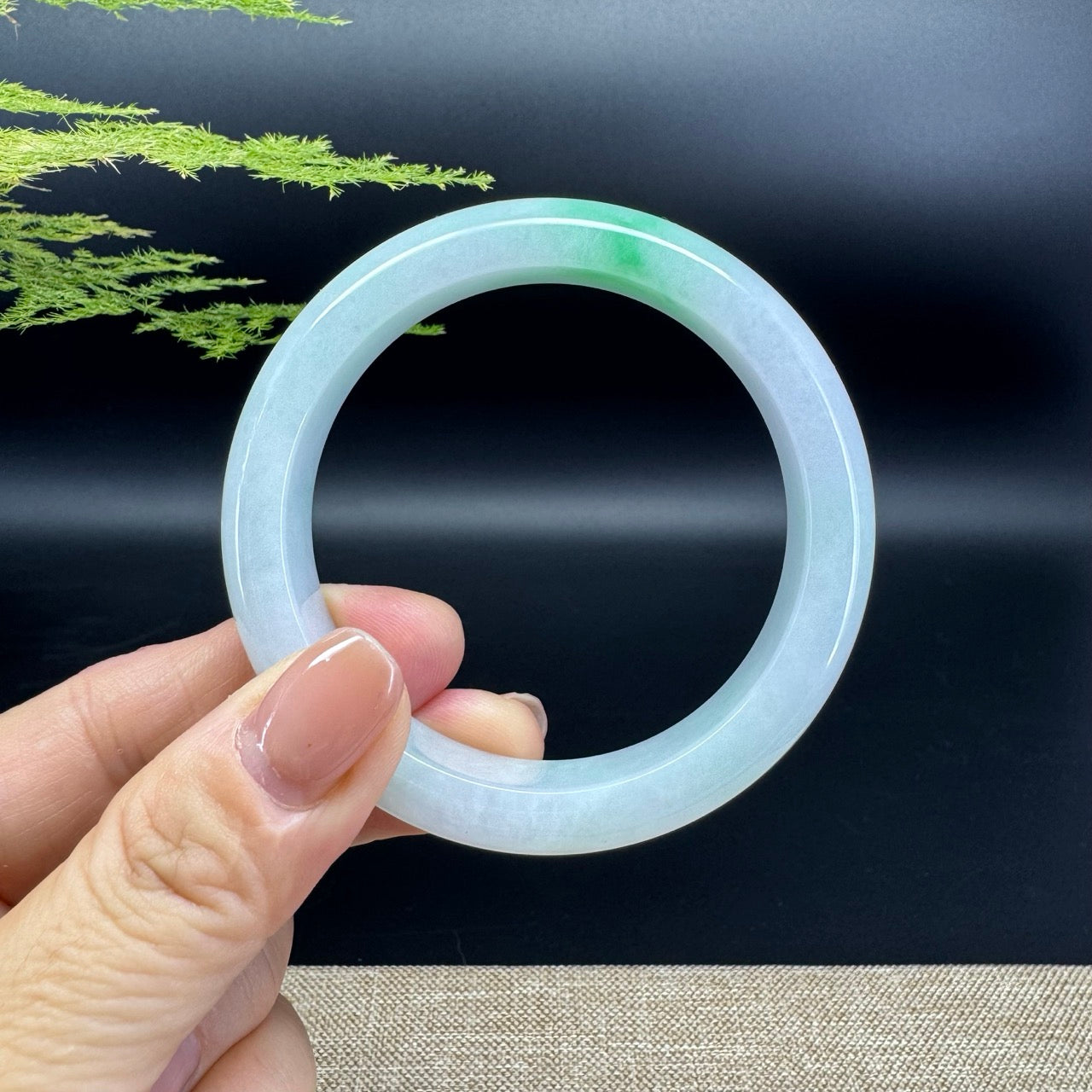 The bangle shape of the half round.The bangle color is green.