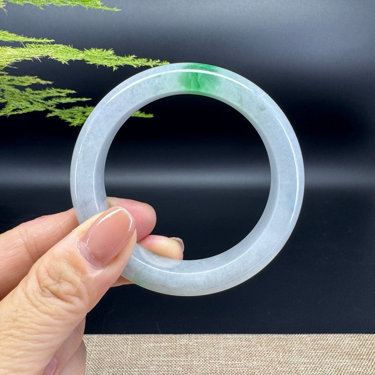 The bangle shape of the half round.The bangle color is light lavender green.