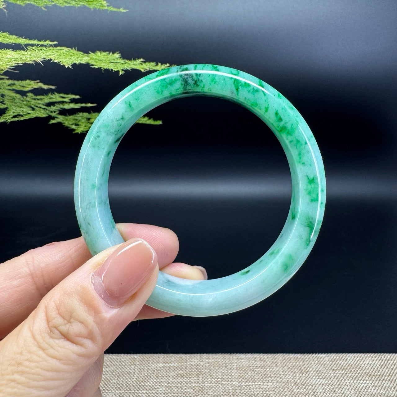 The bangle shape of the half round.The bangle color is green.