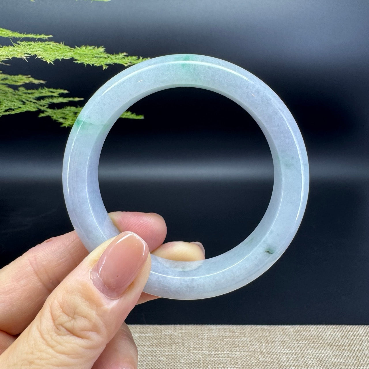 The bangle shape of the half round.The bangle color is icy green.
