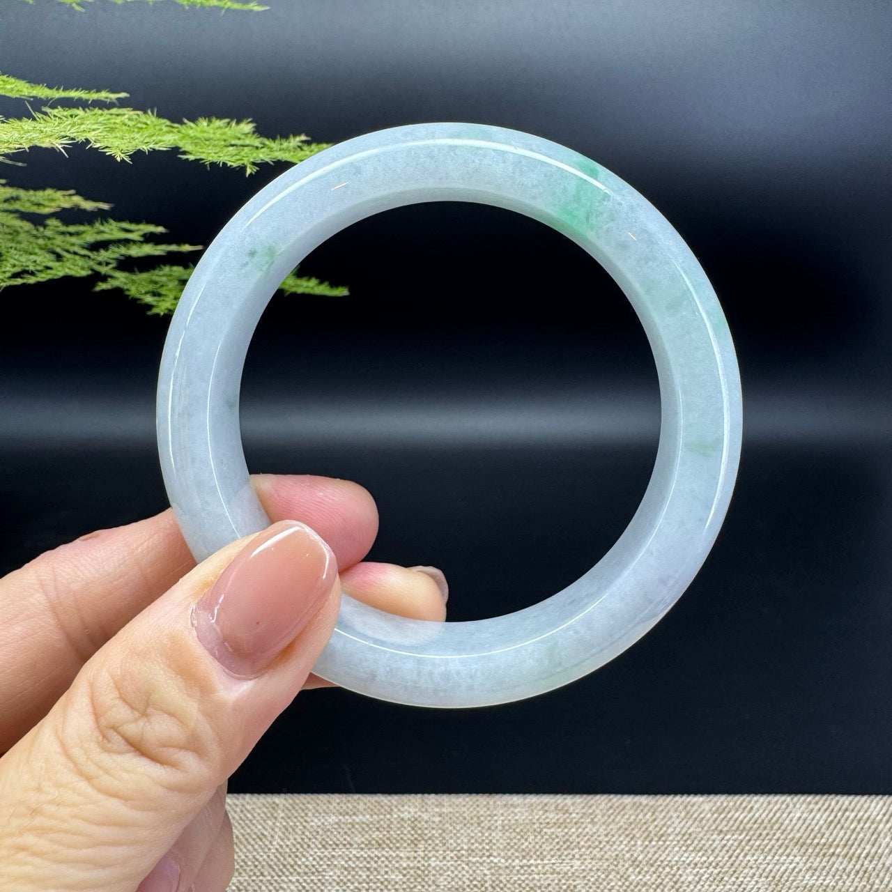 The bangle shape of the half round.The bangle color is icy lavender green.