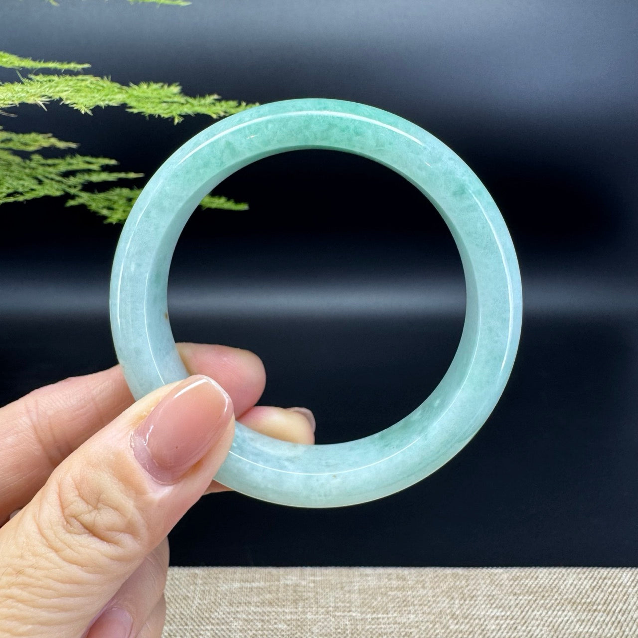 The bangle shape of the half round.The bangle color is apple green.