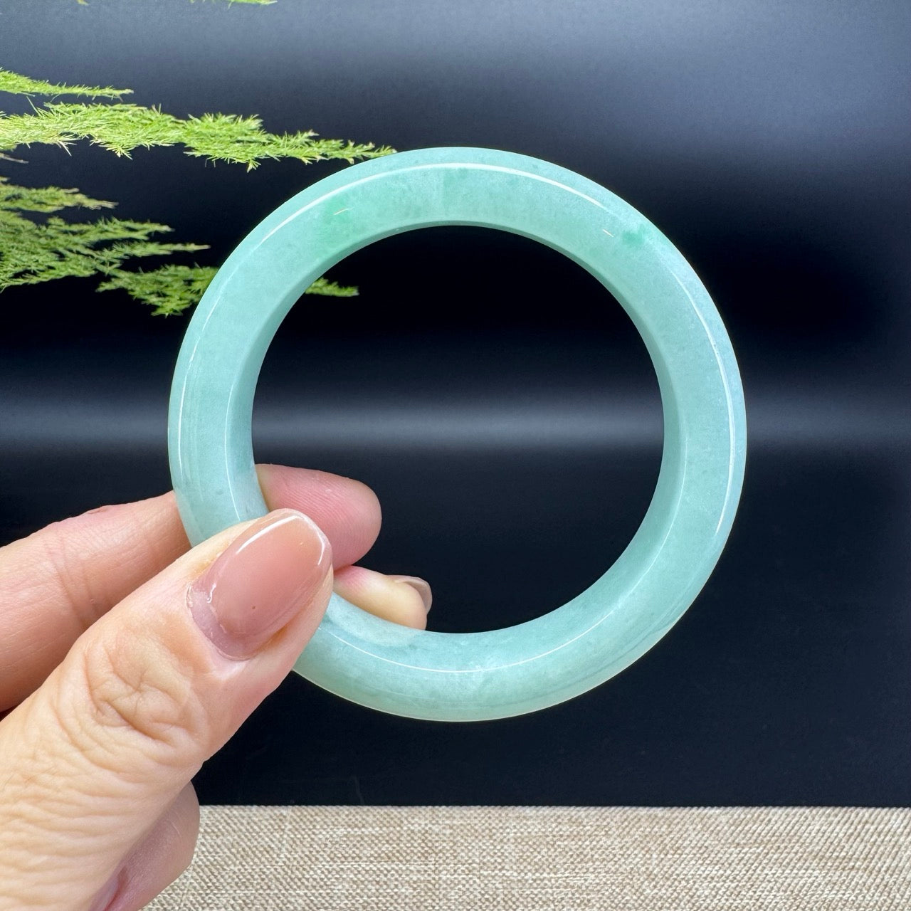 The bangle shape of the half round.The bangle color is apple green.