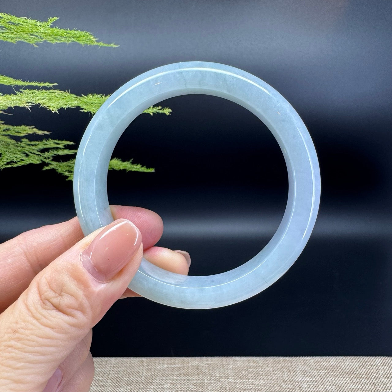 The bangle shape of the half round.The bangle color is icy.