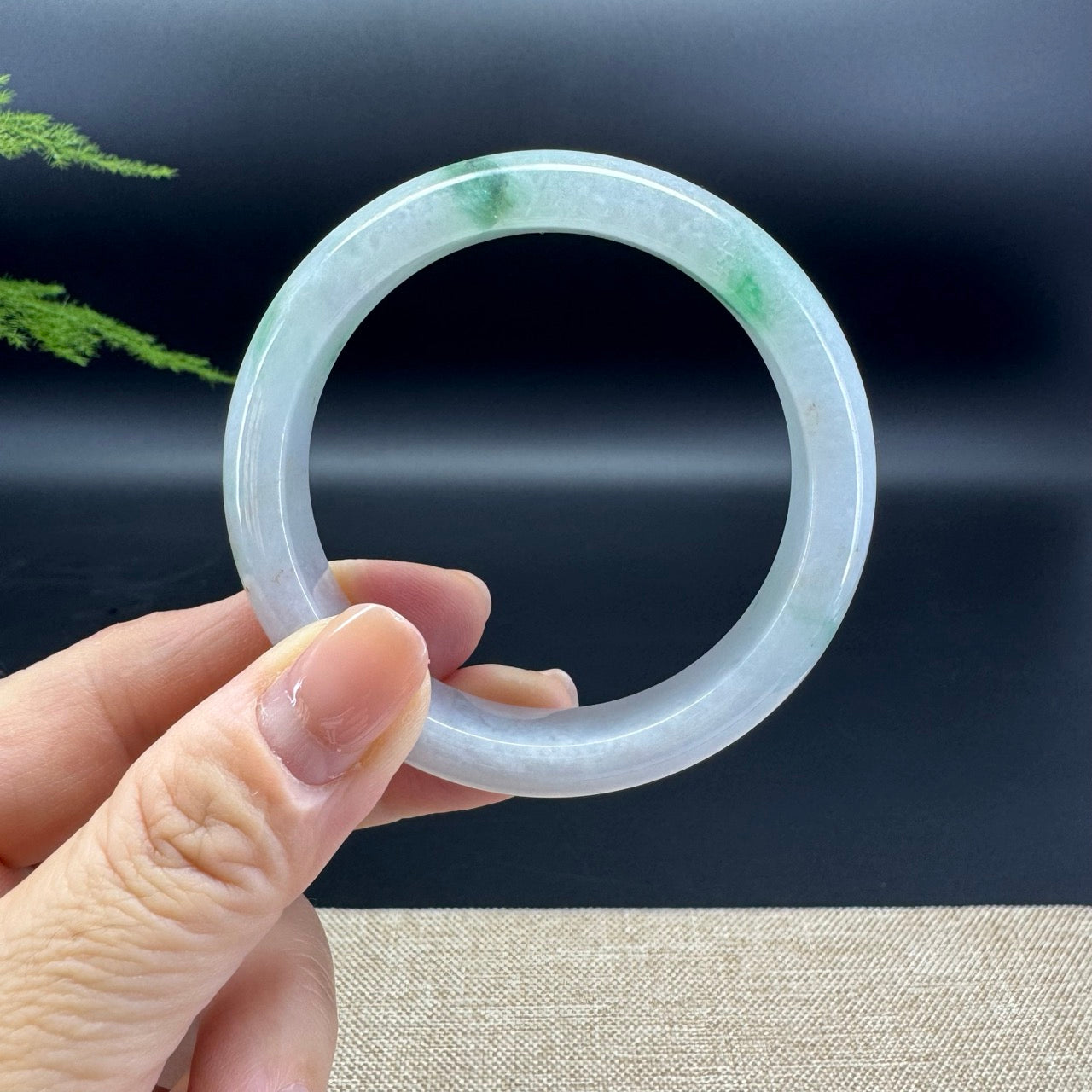 The bangle shape of the half round.The bangle color is icy green.