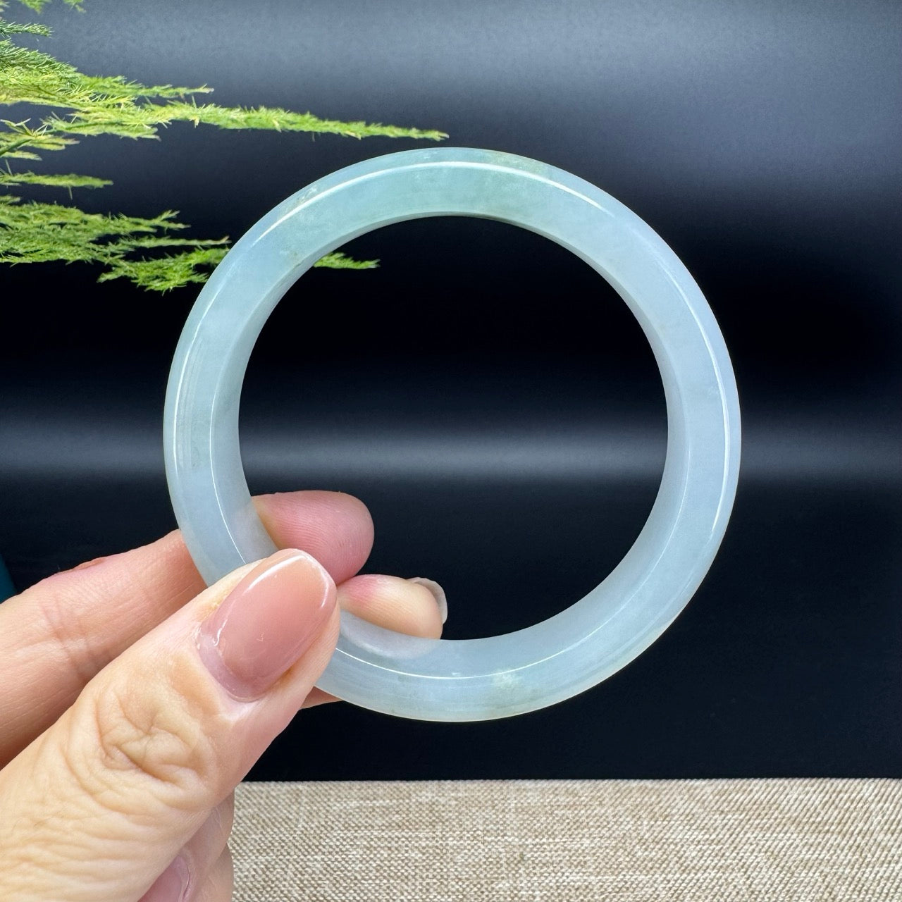 The bangle shape of the half round.The bangle color is icy green.