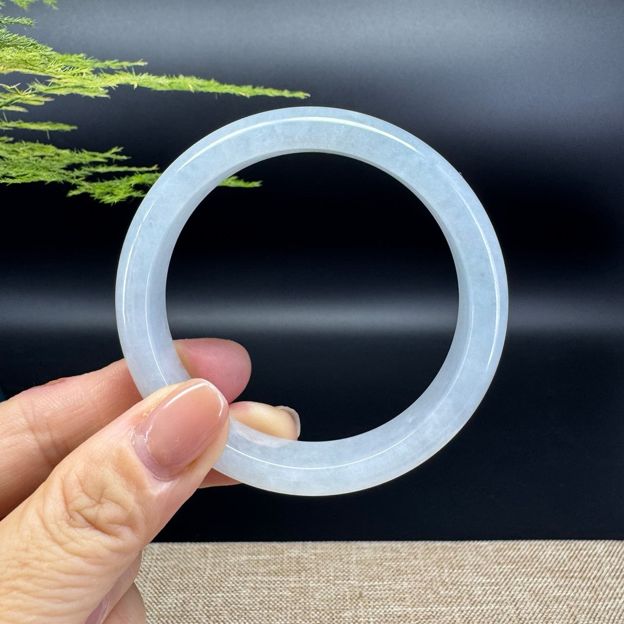 The bangle shape of the half round.The bangle color is icy.