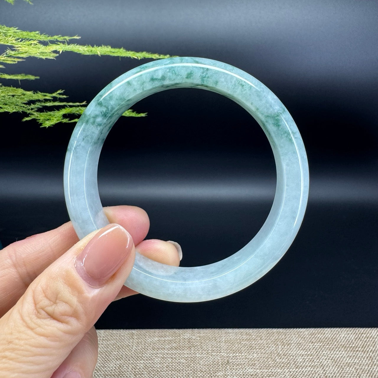 The bangle shape of the half round.The bangle color is icy oil green.