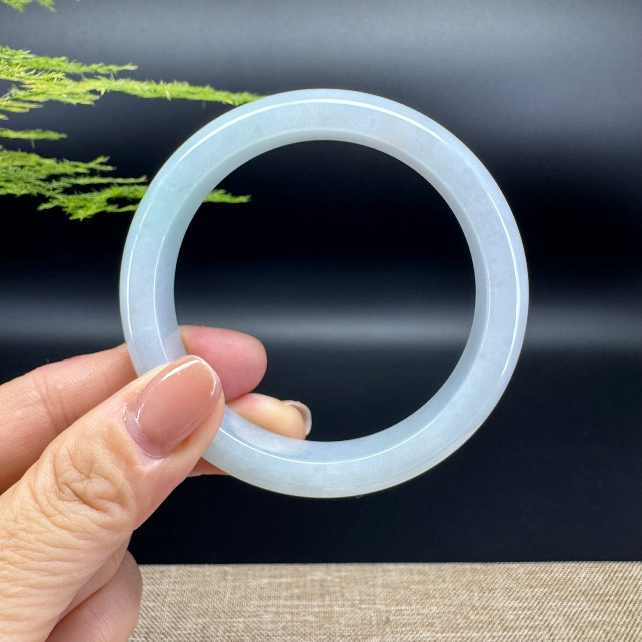 The bangle shape of the half round.The bangle color is lavender.