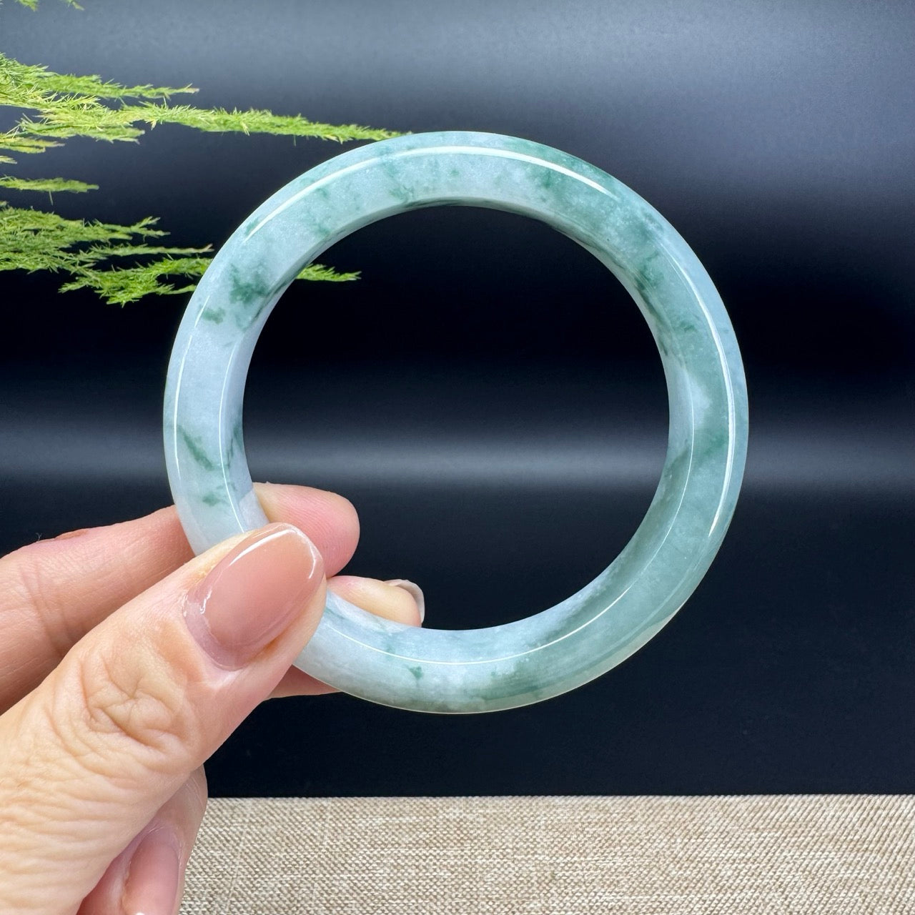 The bangle shape of the half round.The bangle color is lavender green.