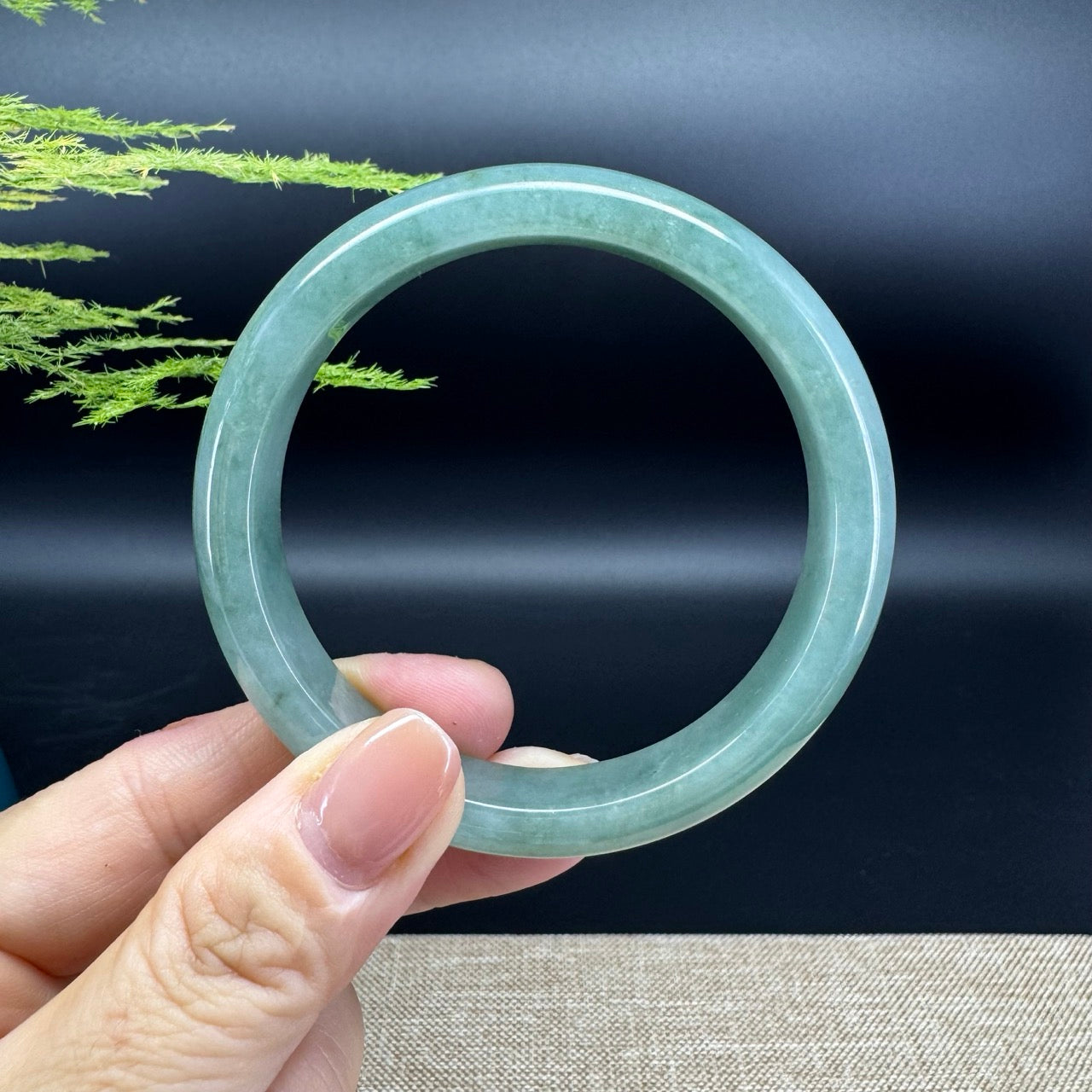 The bangle shape of the half round.The bangle color is oil green.