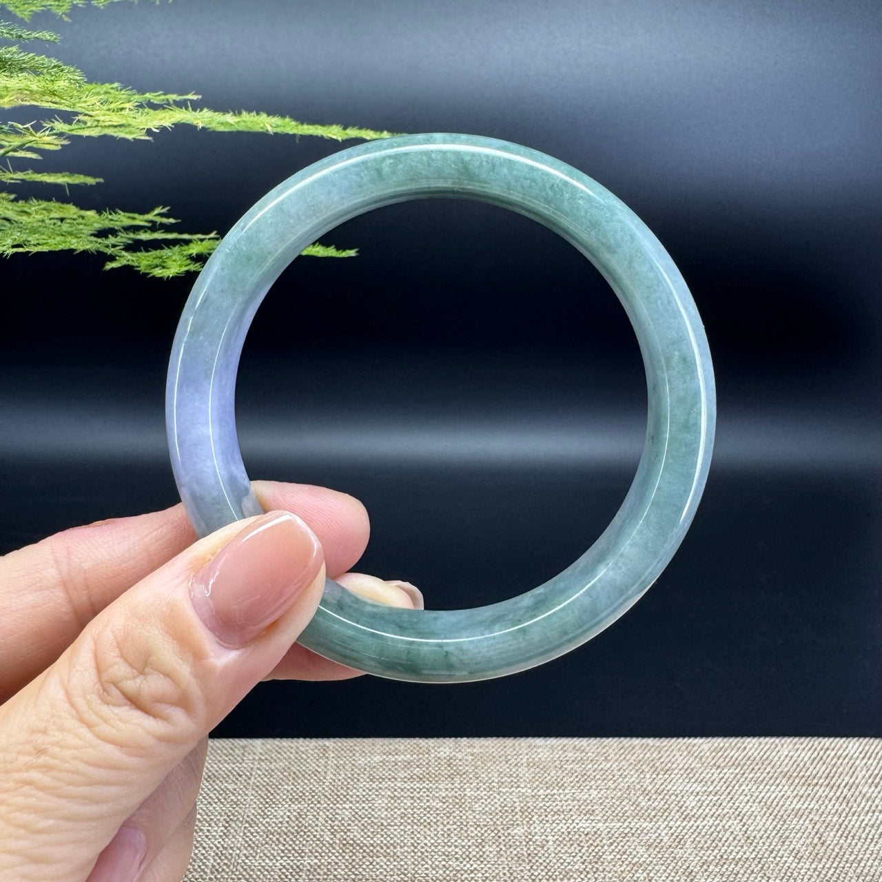 The bangle shape of the half round.The bangle color is lavender green.