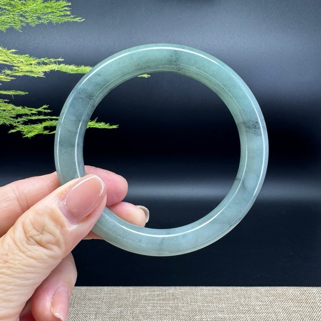 The bangle shape of the round.The bangle color is icy blue green.