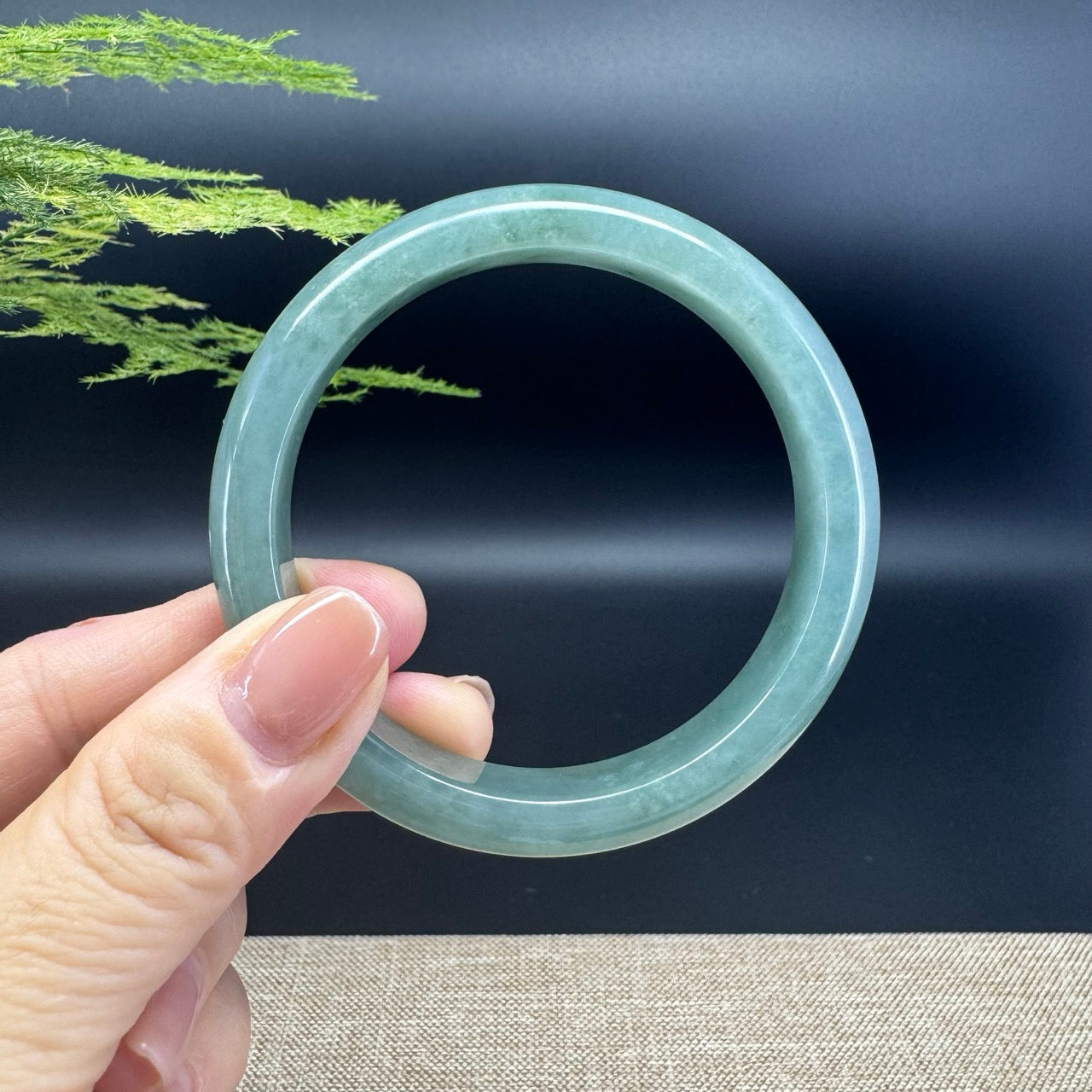 The bangle shape of the half round.The bangle color is oil green.