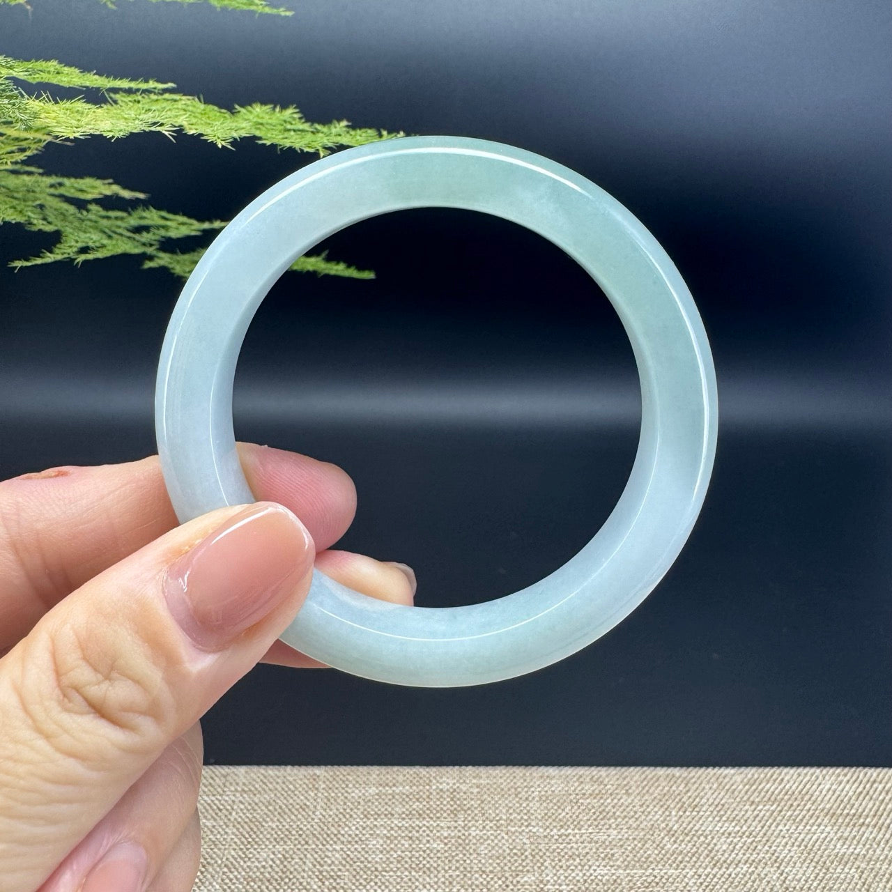 The bangle shape of the half round.The bangle color is icy green.