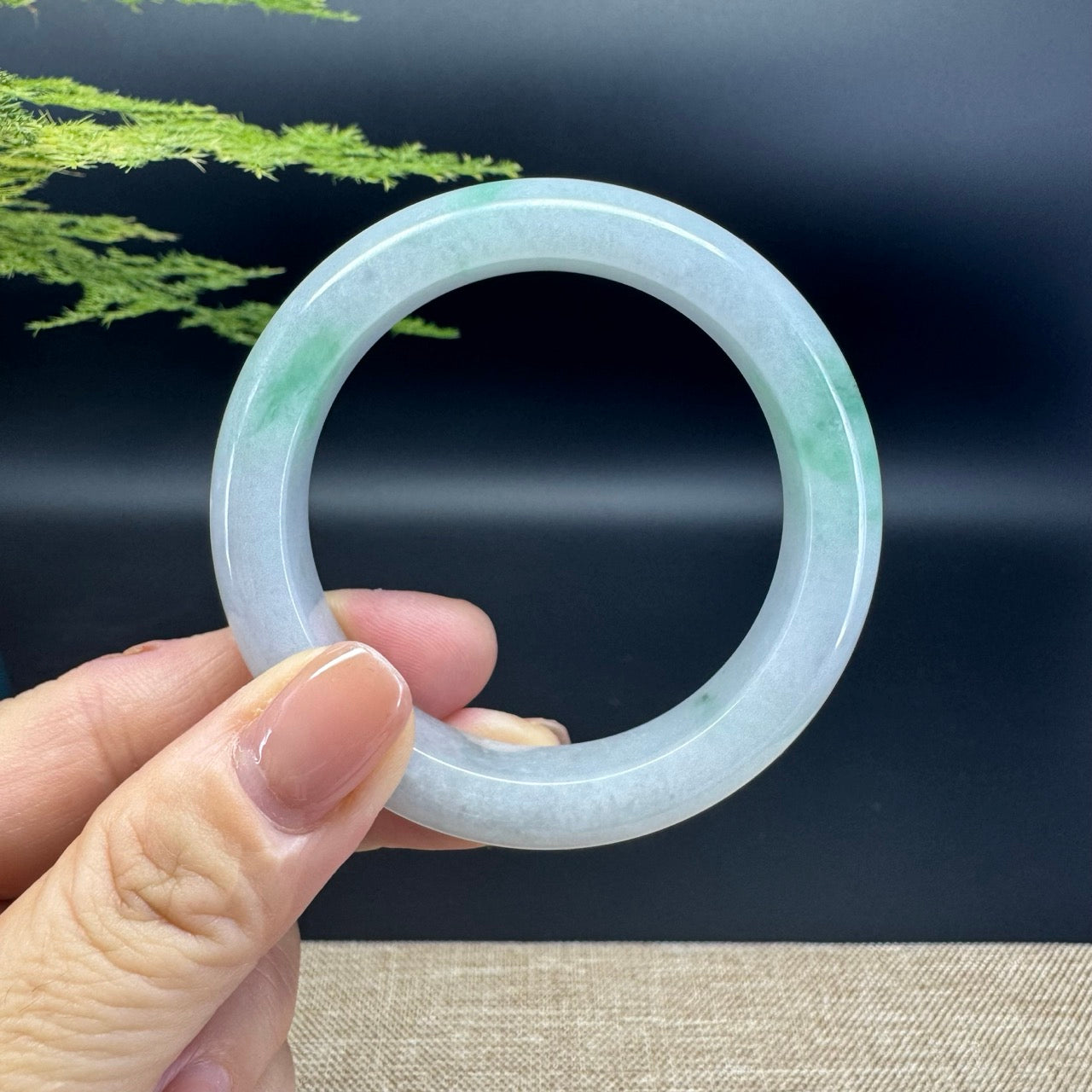 The bangle shape of the half round.The bangle color is icy green.