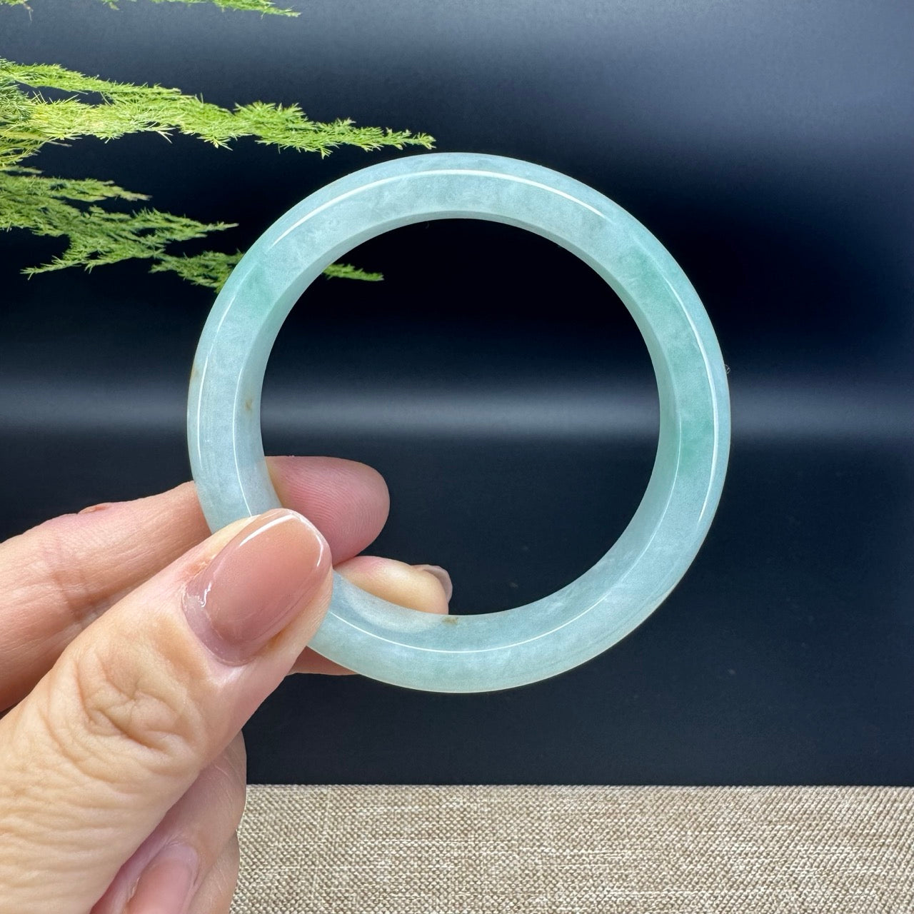 The bangle shape of the half round.The bangle color is green.