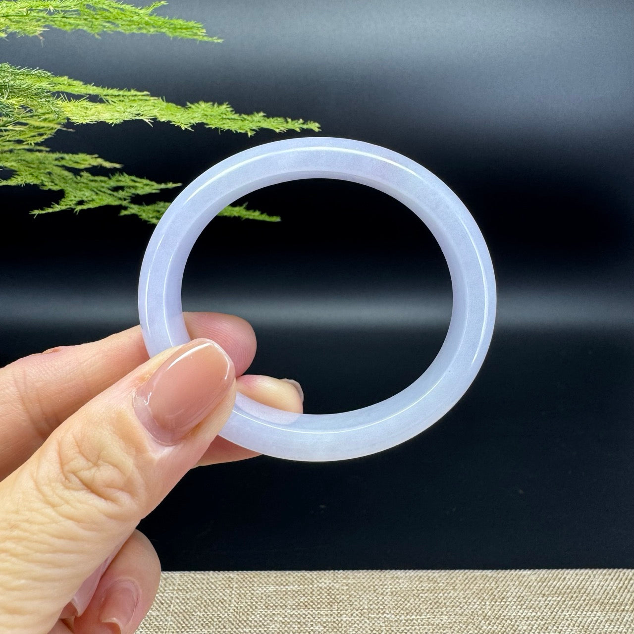 The bangle shape of the half round.The bangle color is lavender.