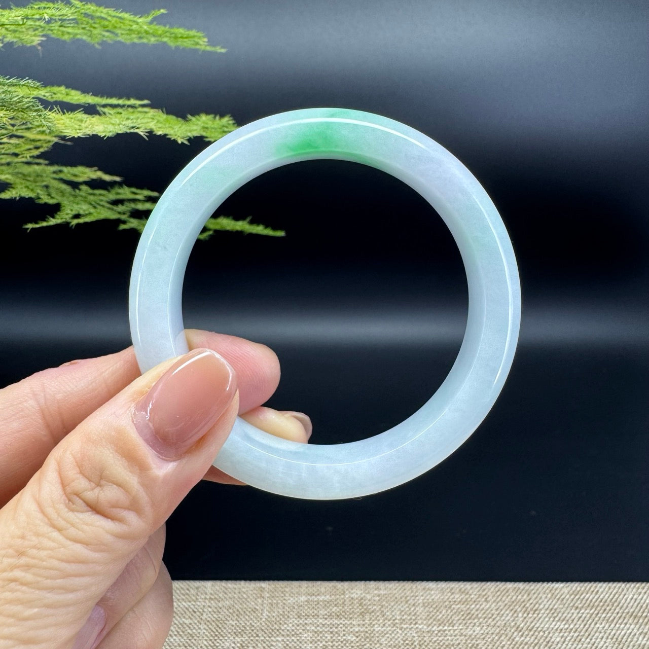 The bangle shape of the half round.The bangle color is icy green.