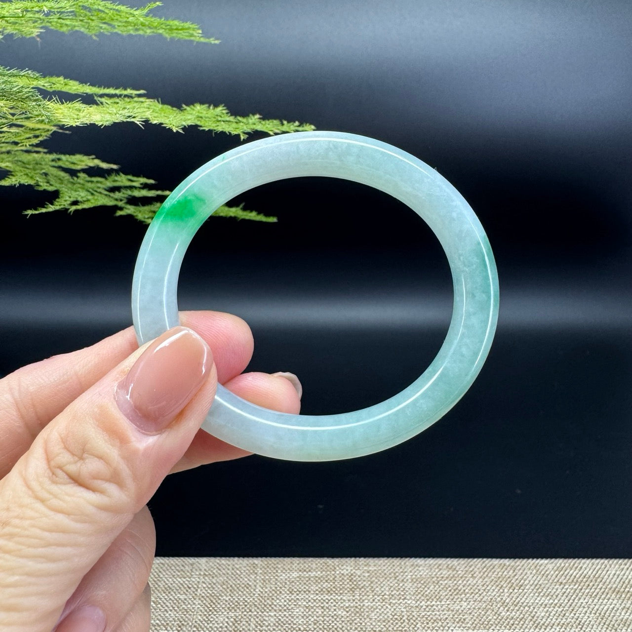The bangle shape of the oval half round.The bangle color is icy green.