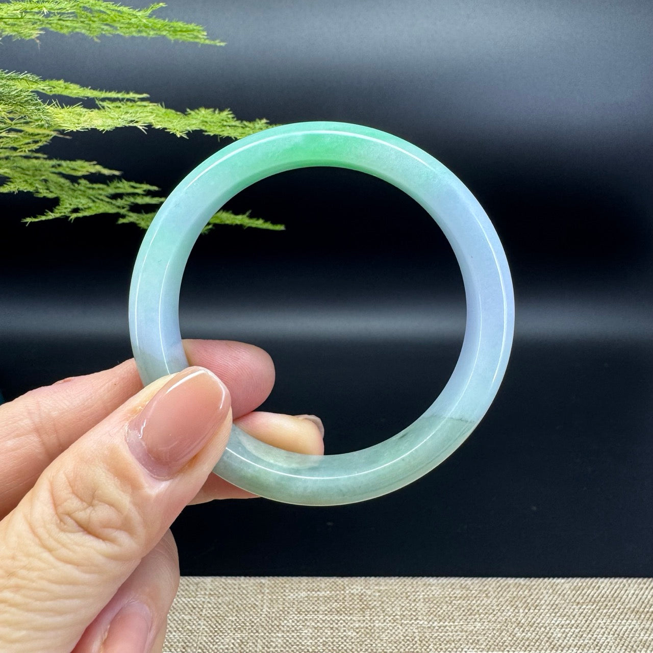 The bangle shape of the half round.The bangle color is lavender green.