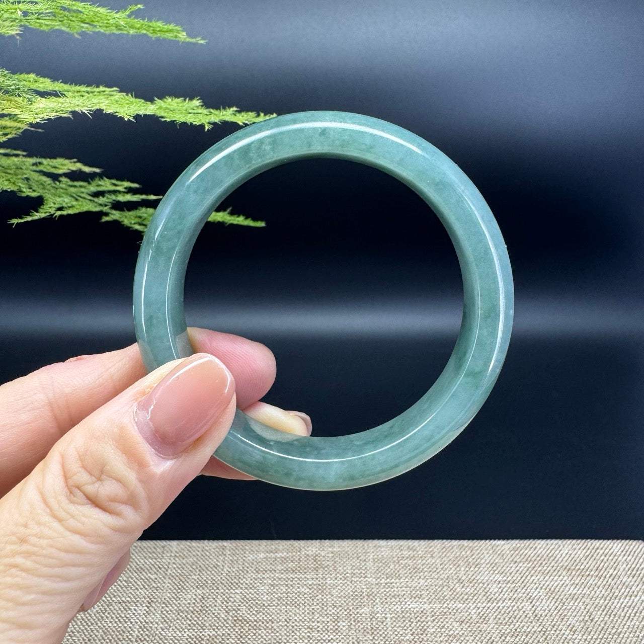 The bangle shape of the half round.The bangle color is oil green.