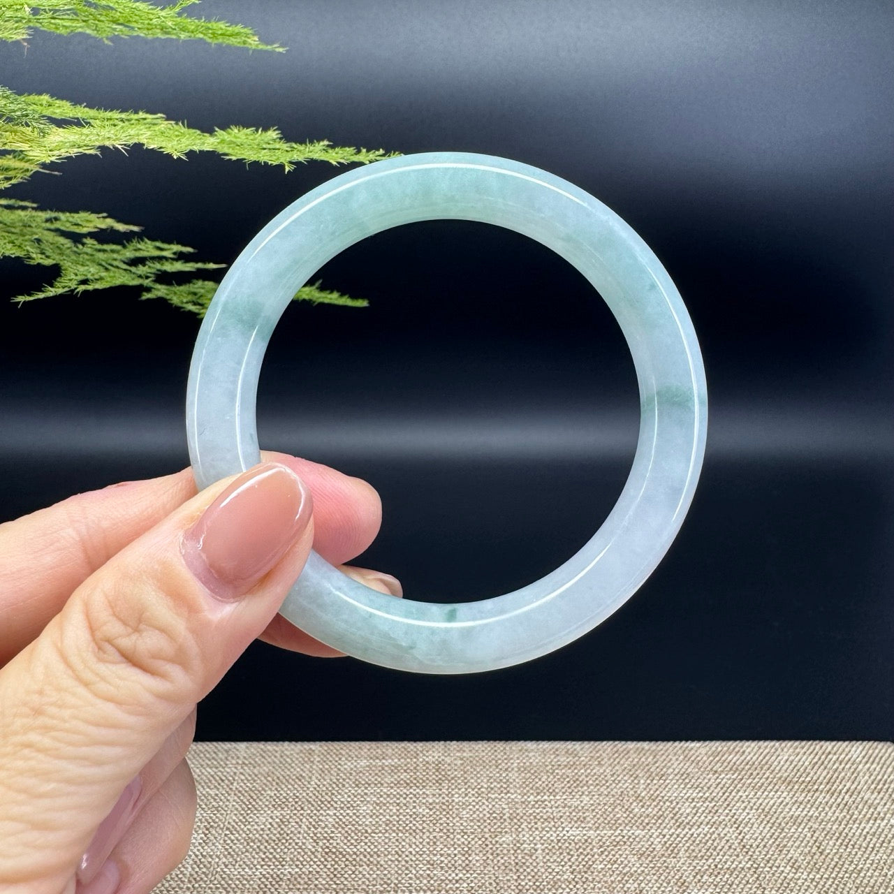 The bangle shape of the half round.The bangle color is icy green.